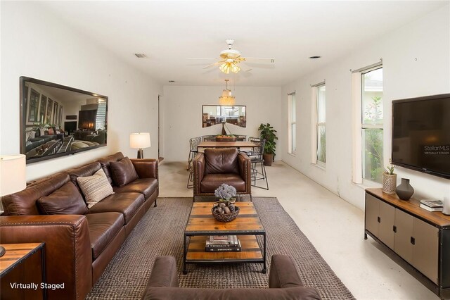 2 Pirates Cv, Ormond Beach, FL 32176 - living area featuring a ceiling fan and light carpet