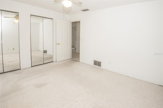 2 Pirates Cv, Ormond Beach, FL 32176 - unfurnished bedroom with multiple closets, carpet floors, and ceiling fan