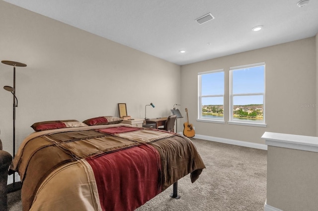 7573 Laureate Blvd Unit 1-404, Orlando, FL 32827 - carpeted bedroom featuring baseboards and recessed lighting
