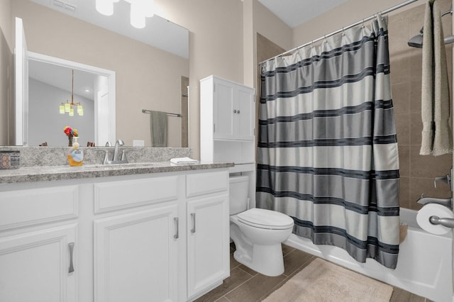 7573 Laureate Blvd Unit 1-404, Orlando, FL 32827 - full bathroom featuring toilet, vanity, and shower / tub combo