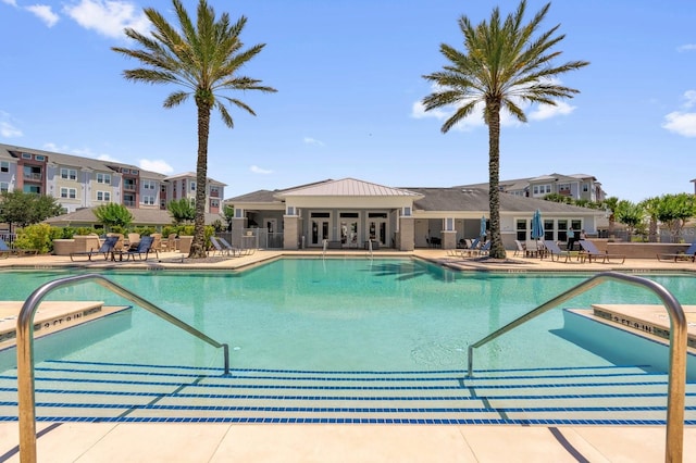 7573 Laureate Blvd Unit 1-404, Orlando, FL 32827 - community pool with a patio area