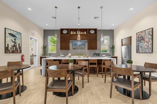 7573 Laureate Blvd Unit 1-404, Orlando, FL 32827 - dining room featuring light wood-type flooring and recessed lighting