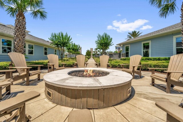 7573 Laureate Blvd Unit 1-404, Orlando, FL 32827 - view of patio / terrace with an outdoor fire pit