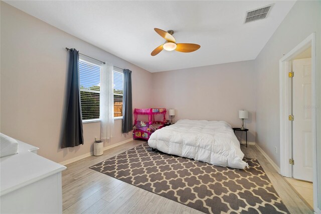 4558 Redmond Pl, Sanford, FL 32771 - bedroom featuring light wood finished floors, baseboards, and a ceiling fan