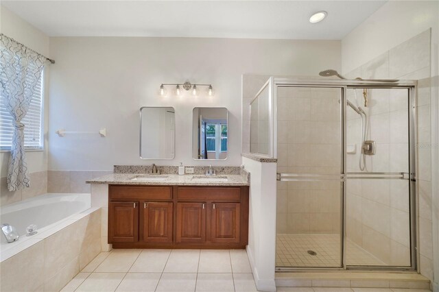 4558 Redmond Pl, Sanford, FL 32771 - full bathroom with a bath, a shower stall, double vanity, and tile patterned flooring
