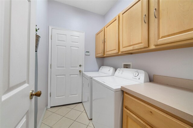 4558 Redmond Pl, Sanford, FL 32771 - laundry room featuring cabinet space, washer and dryer, and light tile patterned floors