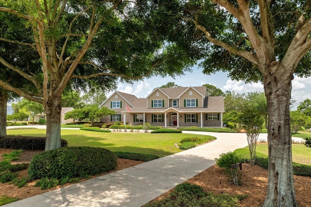17631 Vista Belle Ct, Montverde, FL 34756 - view of front facade featuring a front yard and brick siding