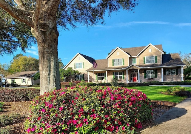 17631 Vista Belle Ct, Montverde, FL 34756 - view of front of home featuring brick siding and a front lawn