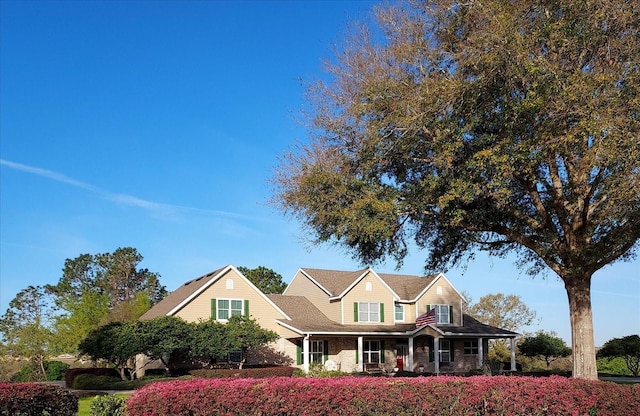 17631 Vista Belle Ct, Montverde, FL 34756 - traditional-style home with covered porch