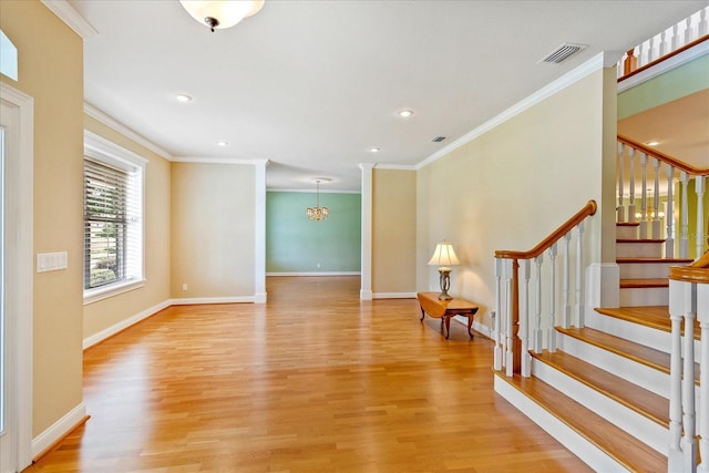 17631 Vista Belle Ct, Montverde, FL 34756 - foyer featuring crown molding, light wood-style flooring, stairway, baseboards, and recessed lighting