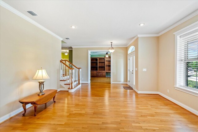17631 Vista Belle Ct, Montverde, FL 34756 - foyer entrance with stairway, light wood-type flooring, baseboards, crown molding, and recessed lighting