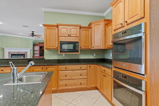 17631 Vista Belle Ct, Montverde, FL 34756 - kitchen featuring black microwave, a sink, crown molding, ceiling fan, and light tile patterned floors