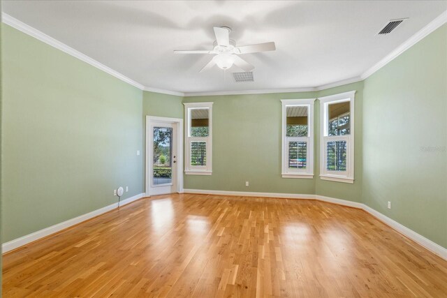 17631 Vista Belle Ct, Montverde, FL 34756 - empty room with light wood-style flooring, a ceiling fan, baseboards, and crown molding