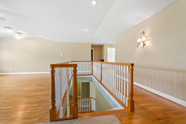 17631 Vista Belle Ct, Montverde, FL 34756 - staircase featuring wood finished floors, baseboards, ceiling fan, recessed lighting, and vaulted ceiling