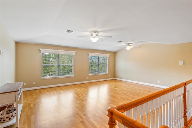 17631 Vista Belle Ct, Montverde, FL 34756 - spare room with ceiling fan, light wood-style floors, baseboards, and vaulted ceiling