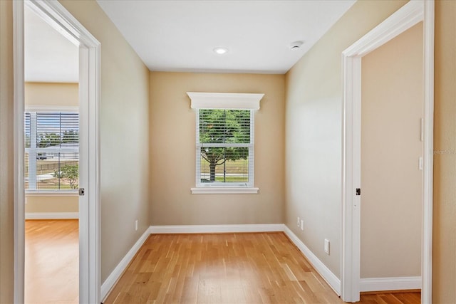 17631 Vista Belle Ct, Montverde, FL 34756 - spare room featuring healthy amount of natural light, light wood finished floors, baseboards, and a smoke detector