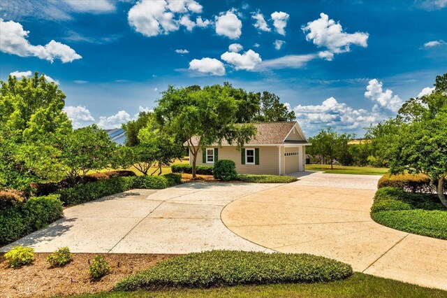 17631 Vista Belle Ct, Montverde, FL 34756 - view of community with driveway and an attached garage