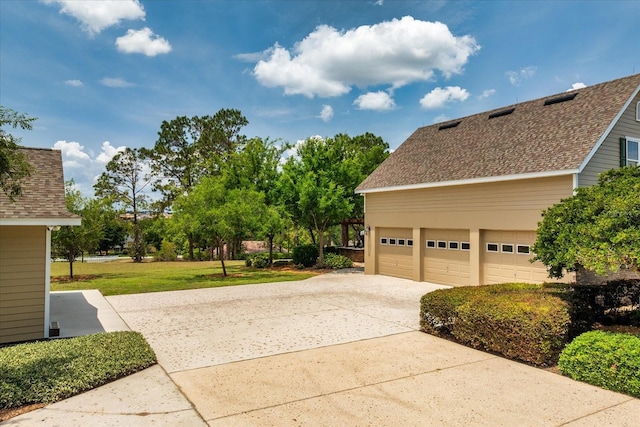 17631 Vista Belle Ct, Montverde, FL 34756 - view of home's exterior with driveway, a shingled roof, and a lawn