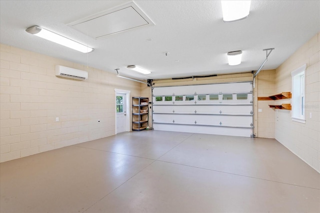 17631 Vista Belle Ct, Montverde, FL 34756 - garage featuring a wall mounted air conditioner and concrete block wall