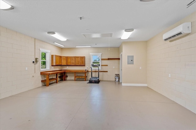17631 Vista Belle Ct, Montverde, FL 34756 - garage with electric panel, a wall unit AC, and concrete block wall