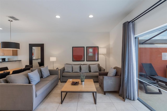 living area featuring recessed lighting and light tile patterned flooring