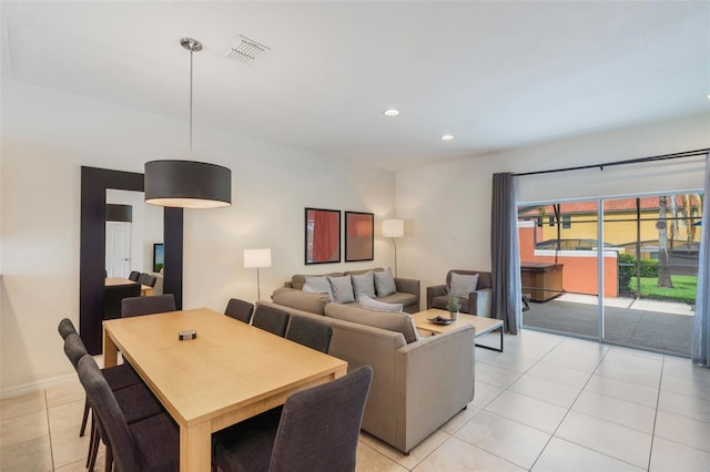 dining space featuring light tile patterned floors and recessed lighting