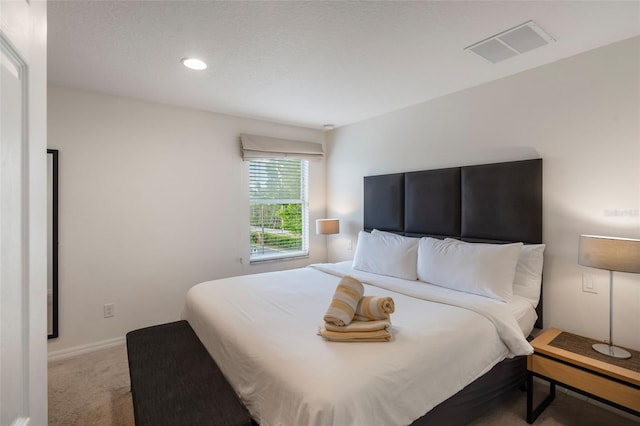 bedroom featuring carpet flooring and recessed lighting