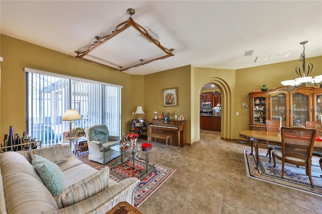 2921 Falconhill Dr, Apopka, FL 32712 - living area with arched walkways and light tile patterned flooring