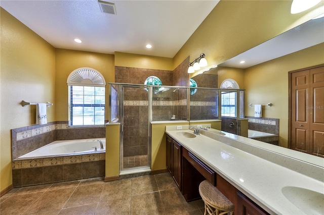 2921 Falconhill Dr, Apopka, FL 32712 - full bath with a stall shower, double vanity, a bath, tile patterned flooring, and recessed lighting