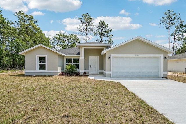 13881 SW 80th Ave, Ocala, FL 34473 - view of front of home featuring an attached garage, driveway, stucco siding, and a front yard