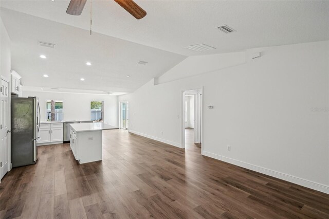 13881 SW 80th Ave, Ocala, FL 34473 - unfurnished living room featuring ceiling fan, dark wood-type flooring, recessed lighting, vaulted ceiling, and baseboards