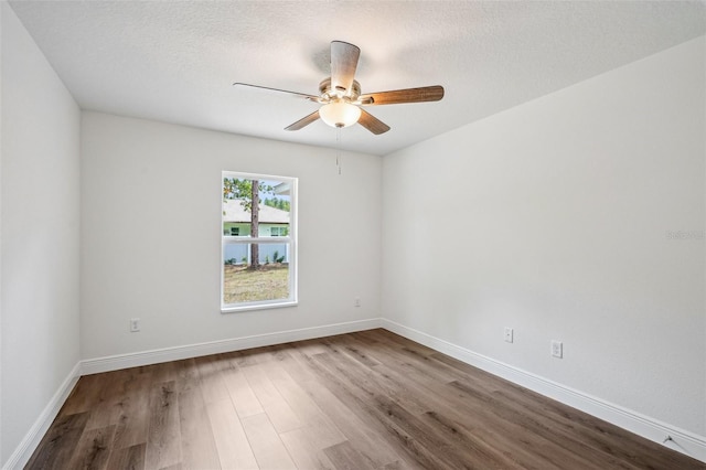 13881 SW 80th Ave, Ocala, FL 34473 - unfurnished room featuring wood finished floors, a ceiling fan, baseboards, and a textured ceiling