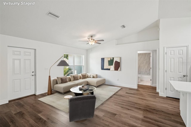 13881 SW 80th Ave, Ocala, FL 34473 - living room with ceiling fan, dark wood-style flooring, vaulted ceiling, and baseboards
