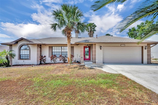 ranch-style house with stucco siding, a garage, driveway, a front lawn, and a shingled roof
