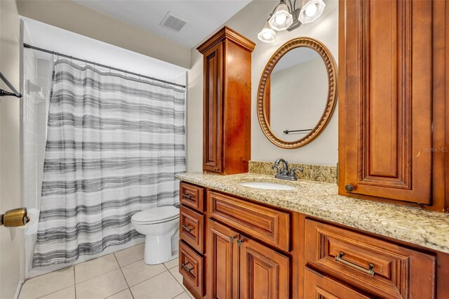 bathroom with tile patterned floors, toilet, vanity, and a shower with shower curtain