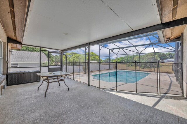 swimming pool featuring a patio and a lanai