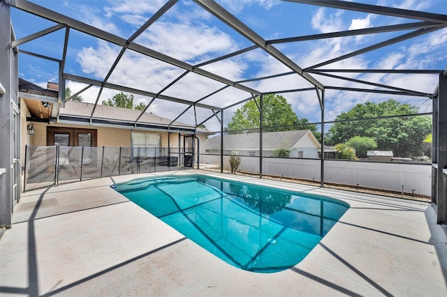 view of pool featuring a patio area, fence, and a lanai