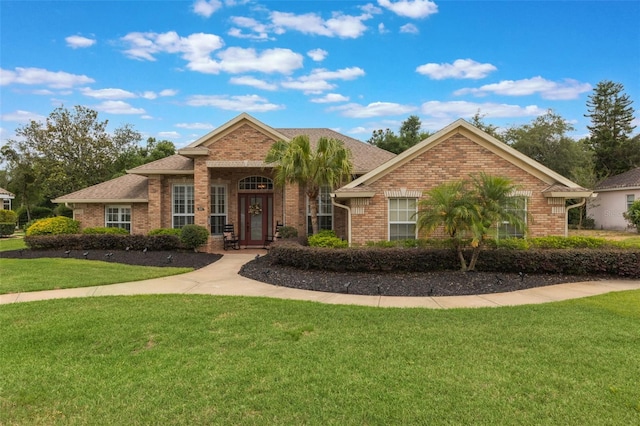 441 Hightower Dr, Debary, FL 32713 - view of front of house featuring brick siding and a front yard