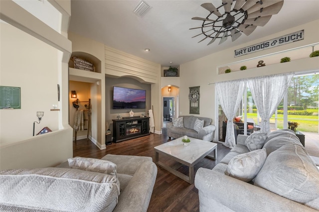 441 Hightower Dr, Debary, FL 32713 - living area with ceiling fan, wood finished floors, arched walkways, recessed lighting, and a fireplace