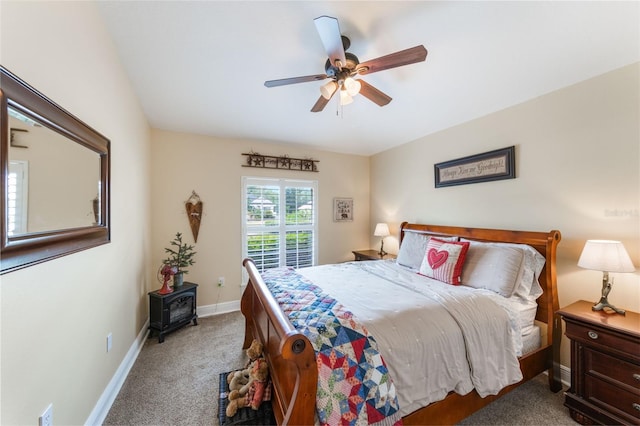 441 Hightower Dr, Debary, FL 32713 - carpeted bedroom with a wood stove, baseboards, and ceiling fan