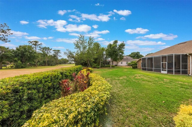 441 Hightower Dr, Debary, FL 32713 - view of grassy yard with a sunroom