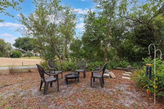 441 Hightower Dr, Debary, FL 32713 - view of yard with an outdoor fire pit