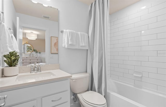 full bath with toilet, vanity, shower / bath combination with curtain, and ensuite bath