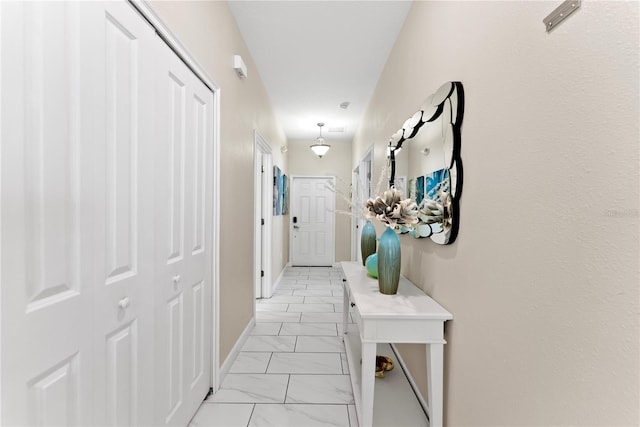 1596 Moon Valley Dr, Davenport, FL 33896 - corridor featuring light marble finish floors and baseboards