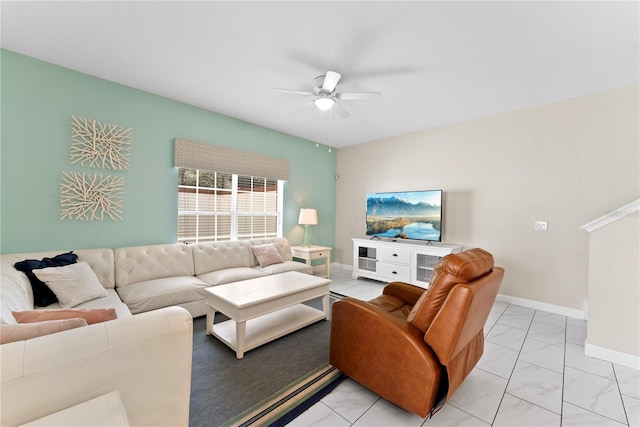 1596 Moon Valley Dr, Davenport, FL 33896 - living room with ceiling fan, light marble finish floors, and baseboards