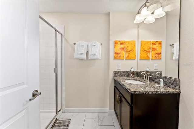 1596 Moon Valley Dr, Davenport, FL 33896 - bathroom with a stall shower, marble finish flooring, vanity, and baseboards