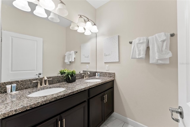 1596 Moon Valley Dr, Davenport, FL 33896 - full bathroom featuring baseboards, double vanity, and marble look tiles
