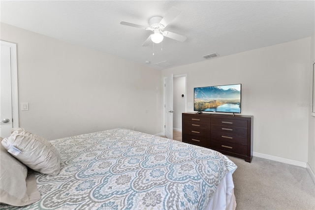 1596 Moon Valley Dr, Davenport, FL 33896 - bedroom with light carpet, baseboards, and a ceiling fan