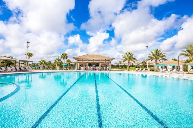 1596 Moon Valley Dr, Davenport, FL 33896 - community pool with a patio and fence