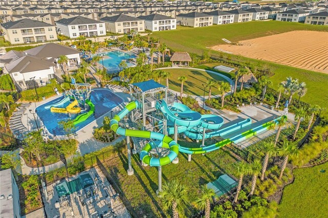 1596 Moon Valley Dr, Davenport, FL 33896 - aerial perspective of suburban area with a pool and a community park